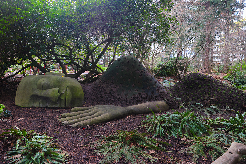 36-foot-long sculpture of a giant sleeping moss lady located at the Beacon Hill Park