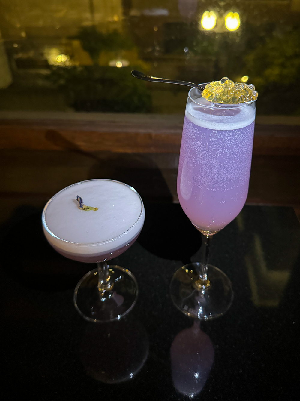 Two purple cocktails from Q at the Fairmont Empress