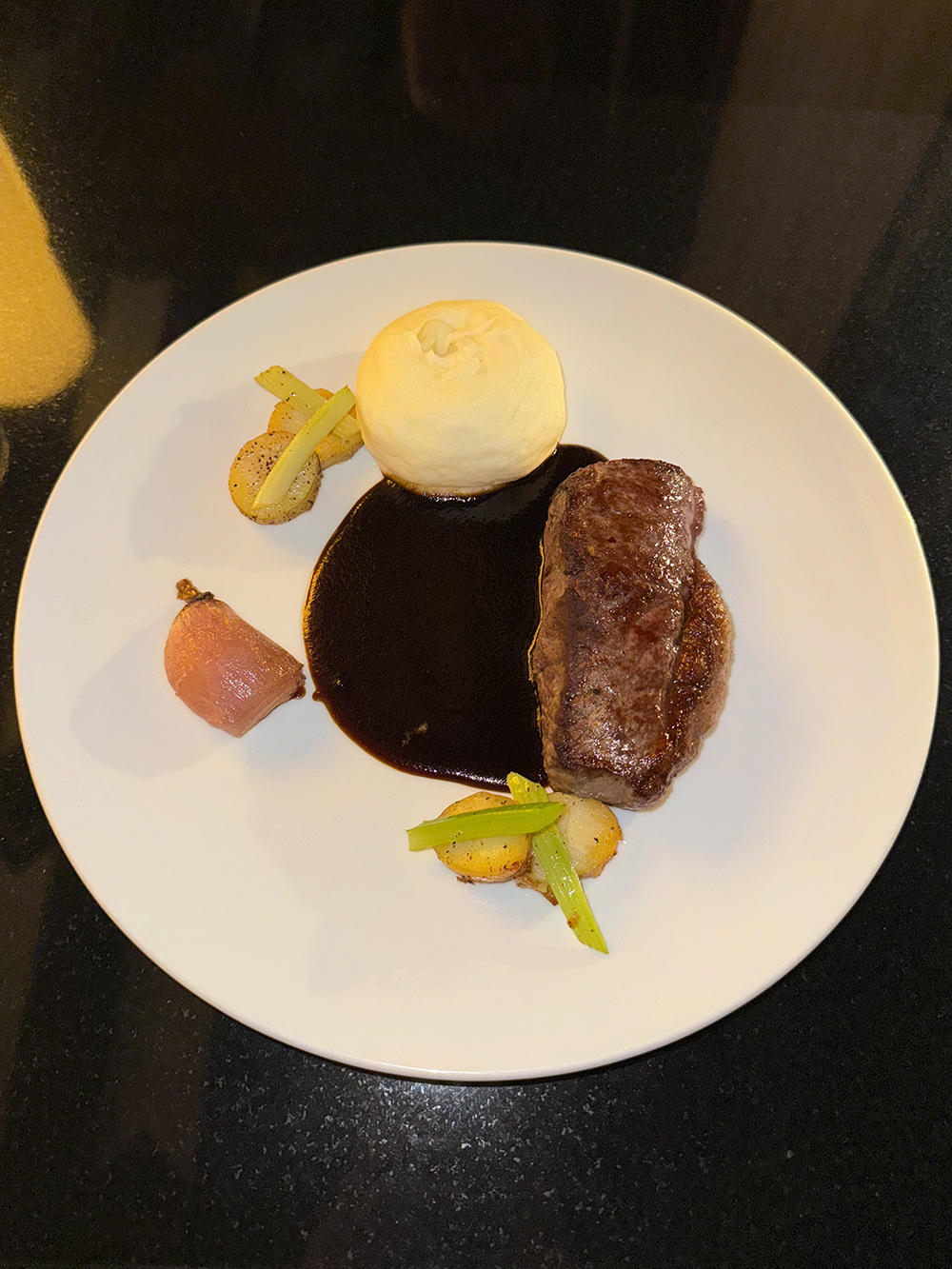 BRANT LAKE WAGYU STRIPLOIN (Wagyu steak, mashed potatoes, and onions) from Q at the Fairmont Empress